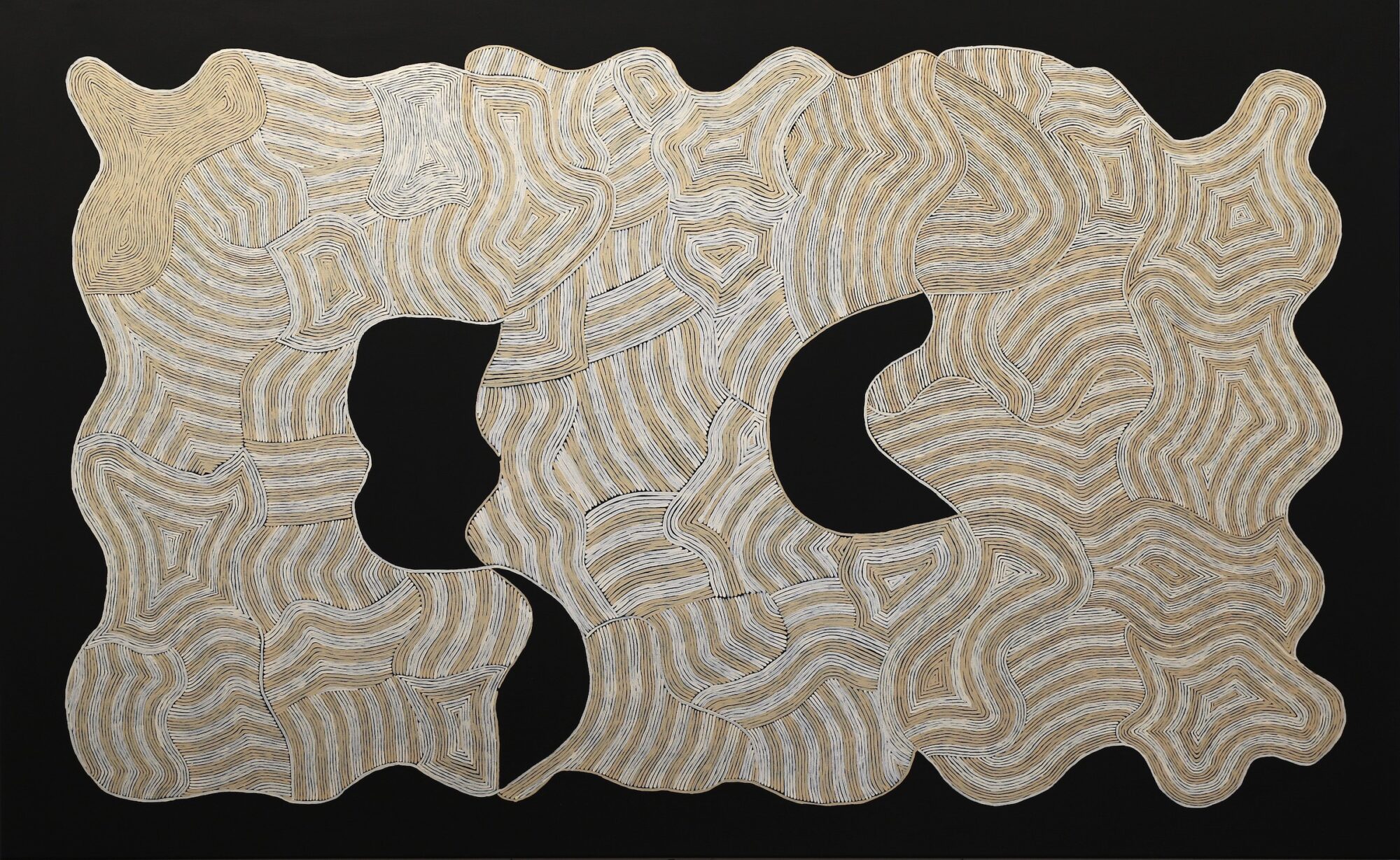 Abstract design painted in cream and pale yellow on a black background.