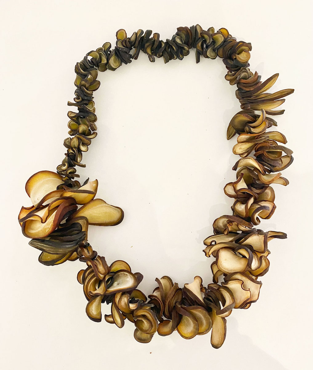 Bulky necklace made from dried pieces of kelp stalk of various shapes